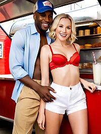 Black man is happy indoors in food truck with 35 year old white woman